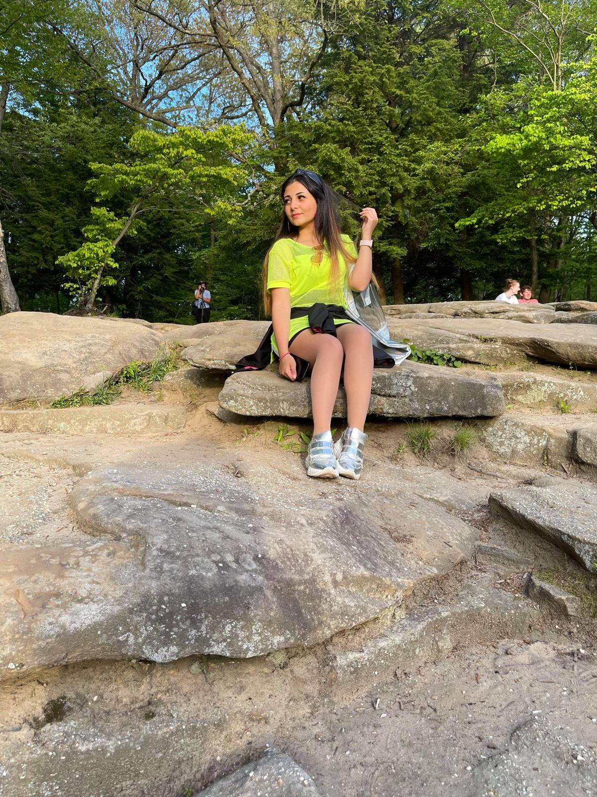 Menna sitting among the trees